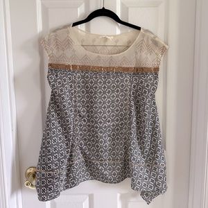 Anthropologie embroidered silk blouse with handkerchief hem